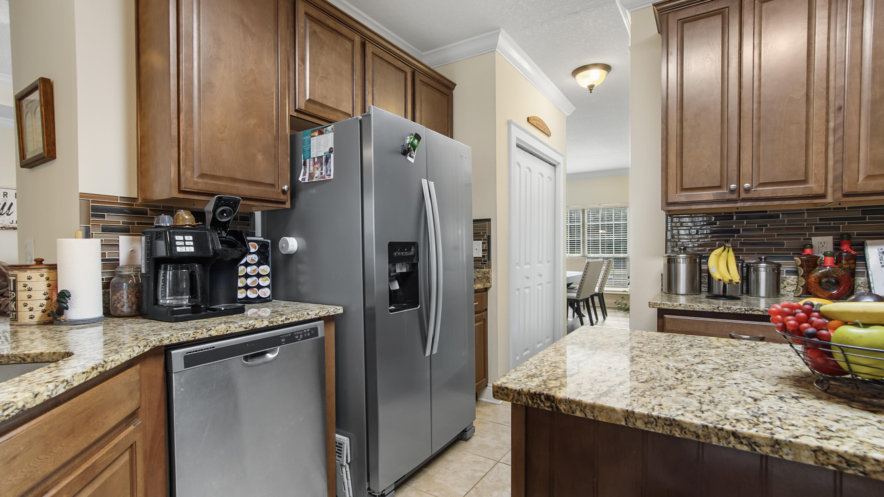 1836 Williams Road DeFuniak Springs, FL 32433 - Photo 33 of 41 a kitchen with stainless steel appliances granite countertop a sink stove and refrigerator