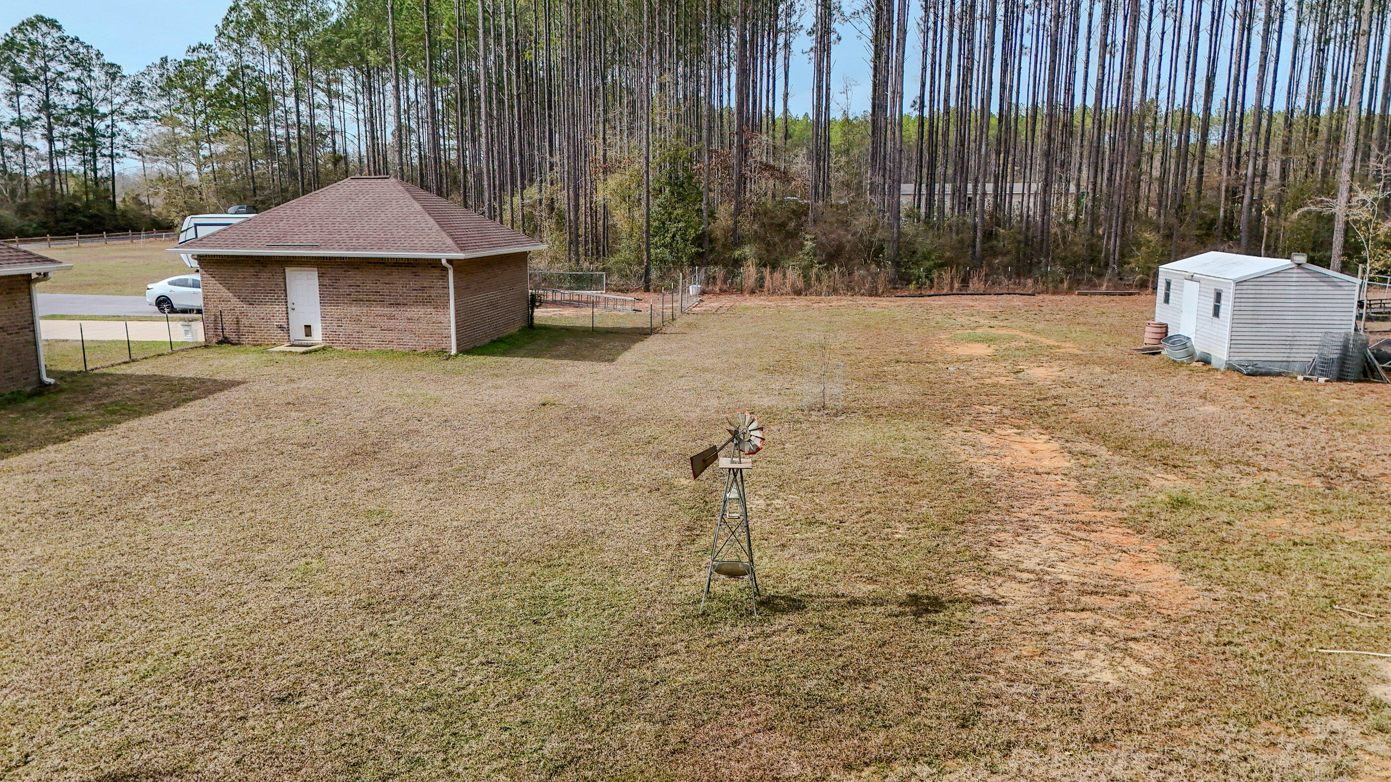 1836 Williams Road DeFuniak Springs, FL 32433 - Photo 8 of 41 a backyard of a house with a table and chairs