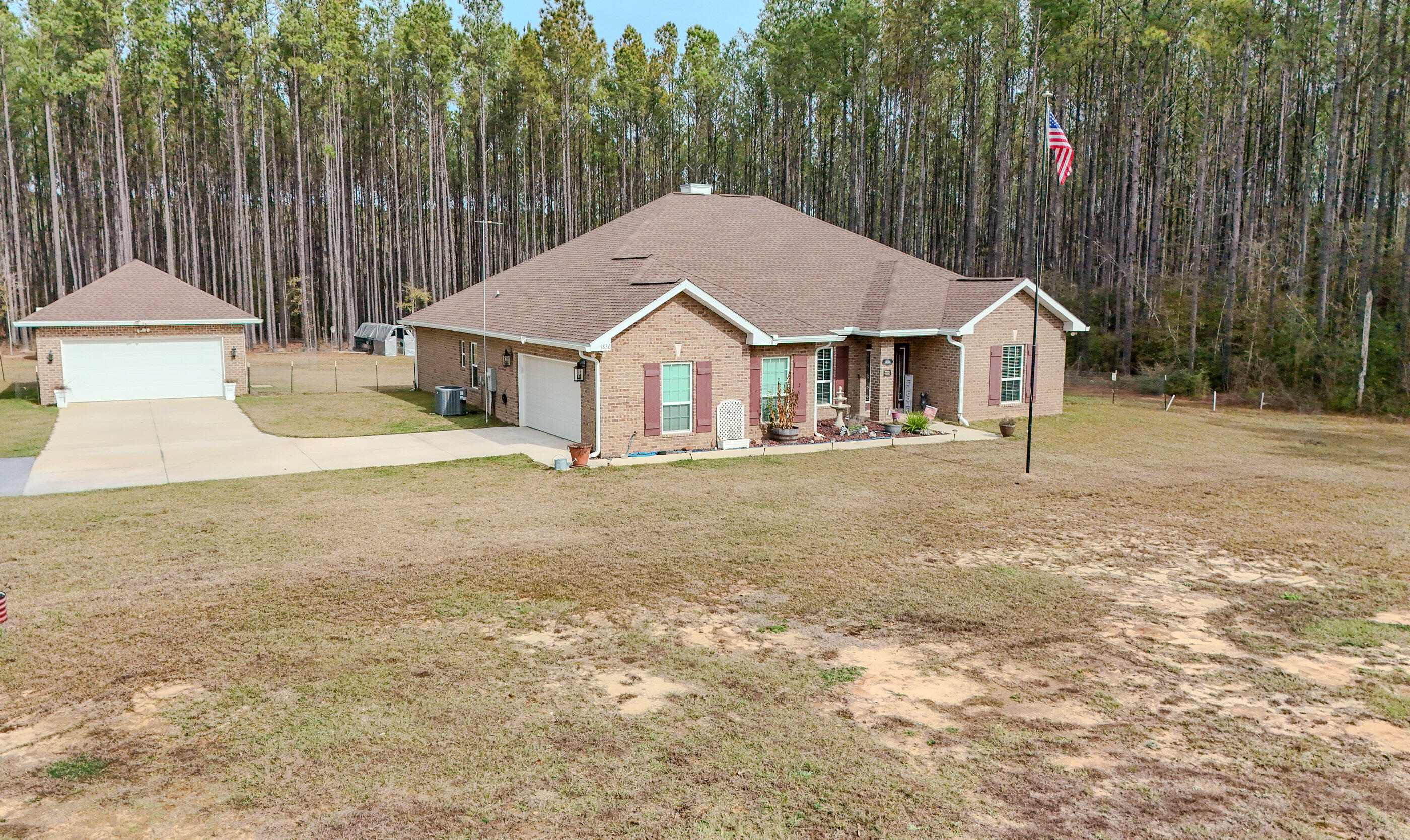 1836 Williams Road DeFuniak Springs, FL 32433 - Photo 10 of 41 a view of a house with a yard and large trees