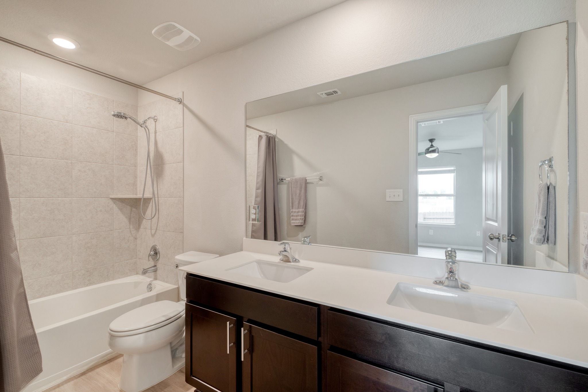 1000 Bright Star Cove Georgetown, TX 78628 - Photo 29 of 40 a bathroom with a sink a toilet a shower and a mirror