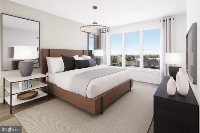 a bedroom with bed and window