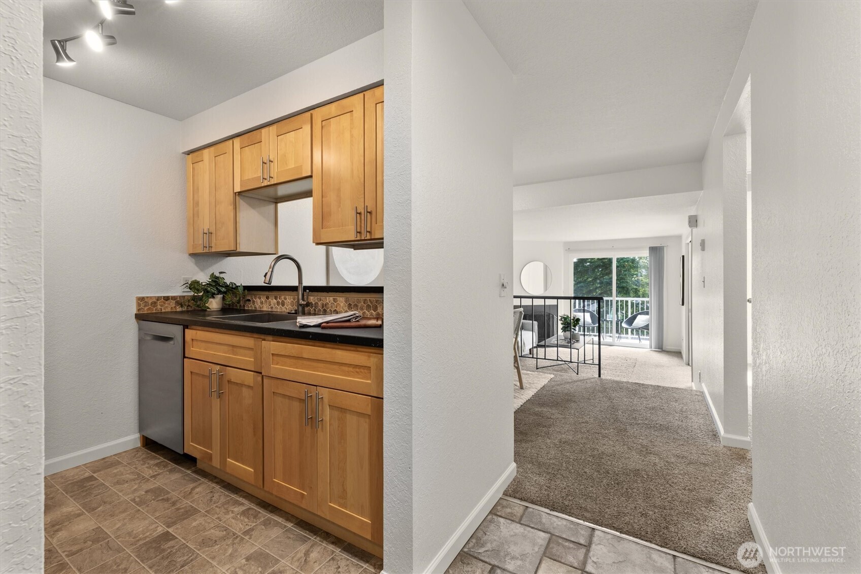 9484 Redmond-Woodinville Road Northeast, Unit C205 Redmond, WA 98052 - Photo 28 of 28 a room with table and chairs