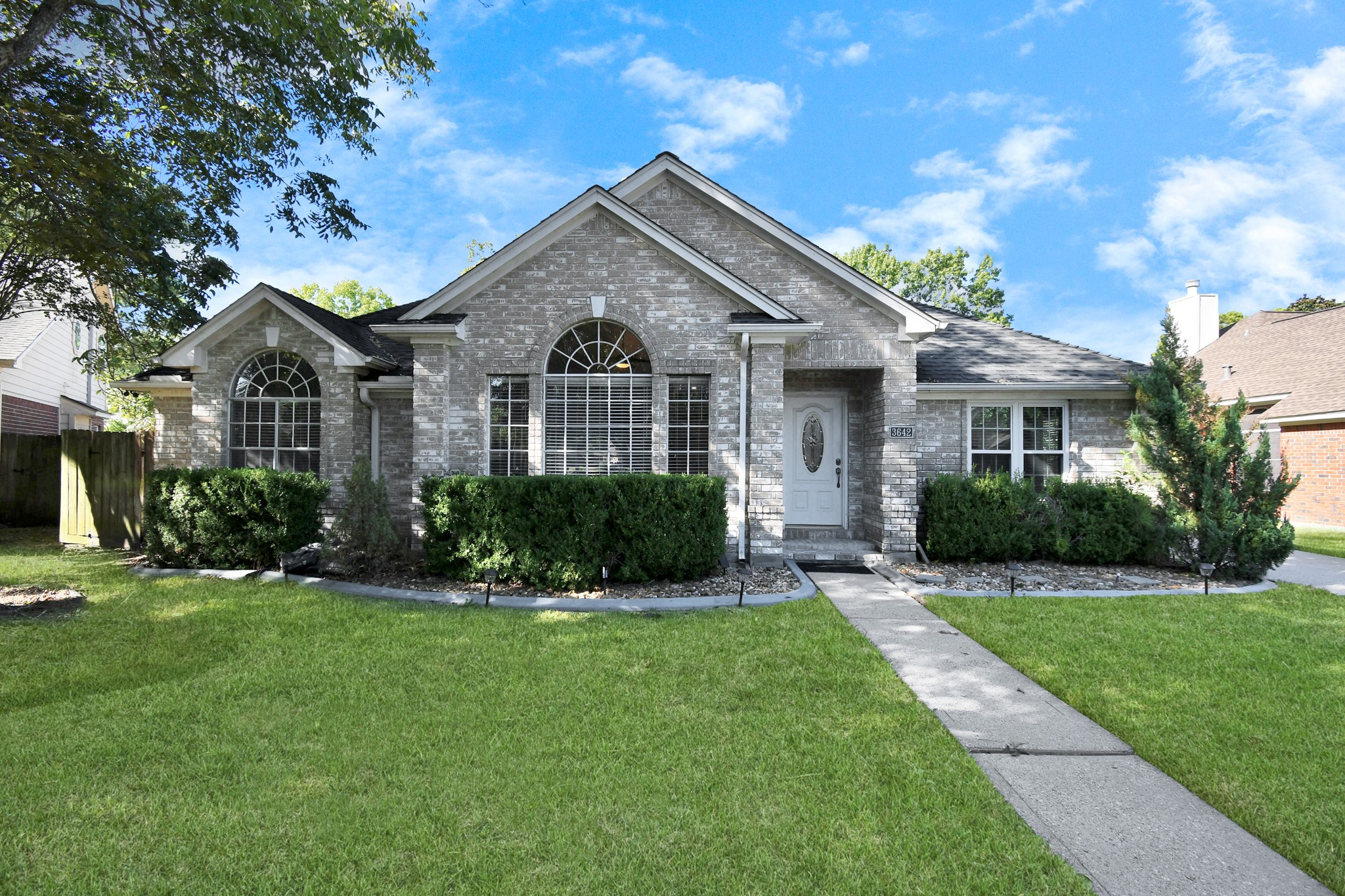 3642 Postwood Drive Spring, TX 77388 - Photo 1 of 43 a front view of a house with a yard