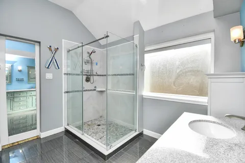 a bathroom with a tub and shower