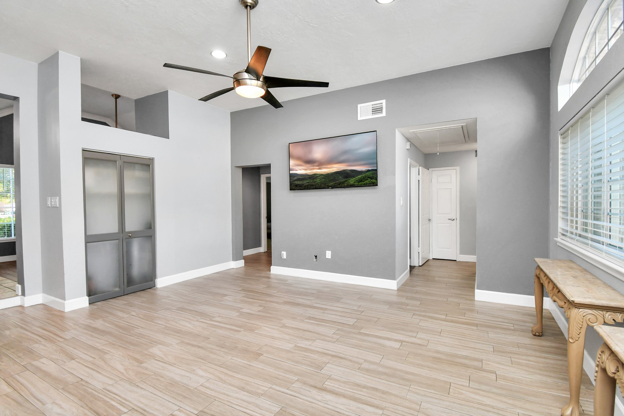3642 Postwood Drive Spring, TX 77388 - Photo 19 of 43 a view of an empty room with wooden floor and a window