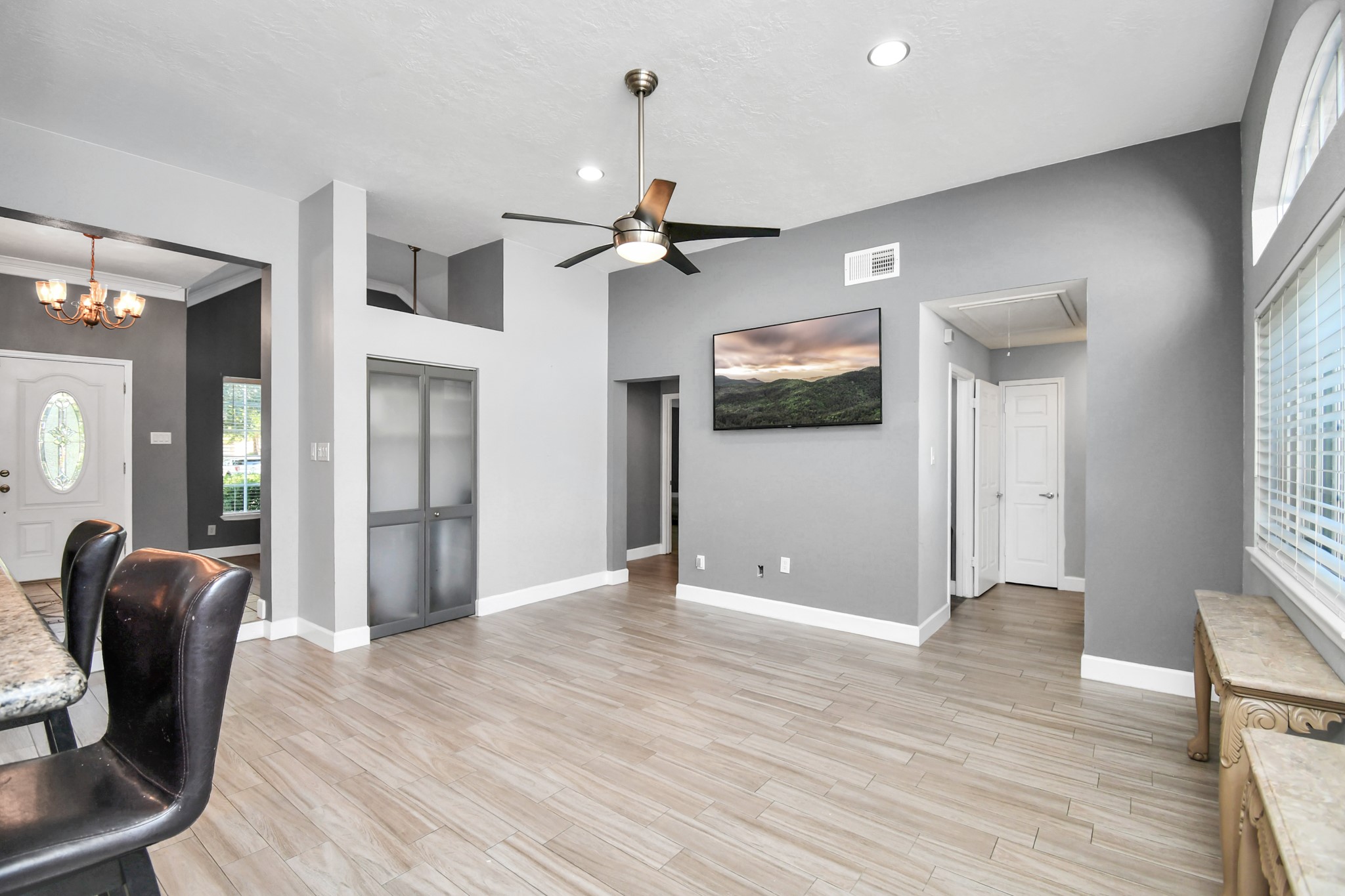 3642 Postwood Drive Spring, TX 77388 - Photo 20 of 43 a view of a livingroom with a chandelier fan and windows
