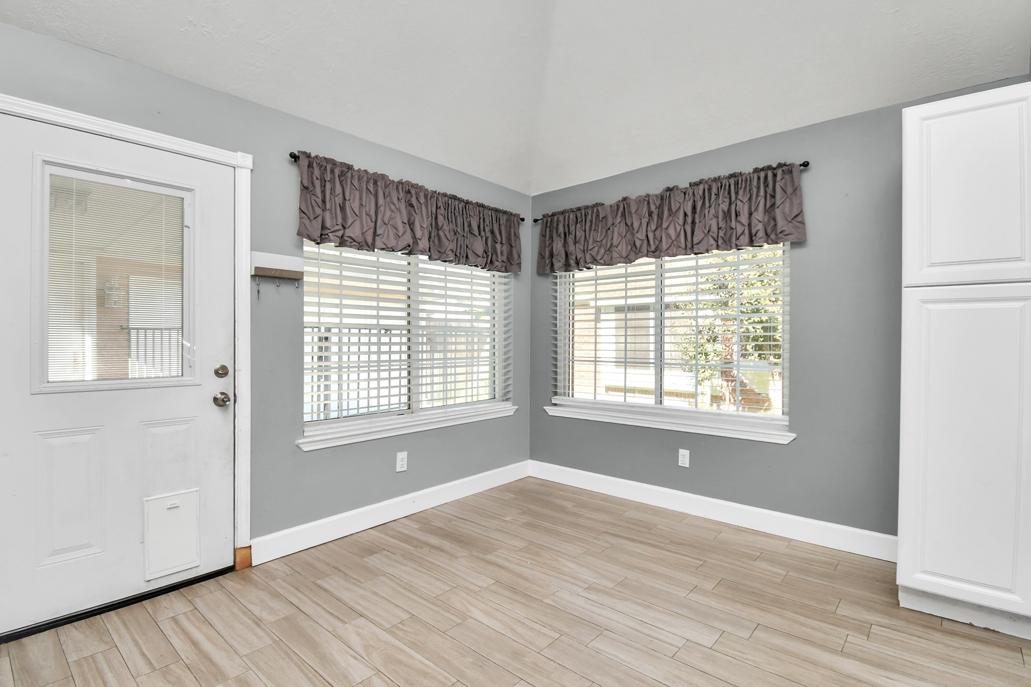 3642 Postwood Drive Spring, TX 77388 - Photo 23 of 43 a view of an empty room with wooden floor and a window
