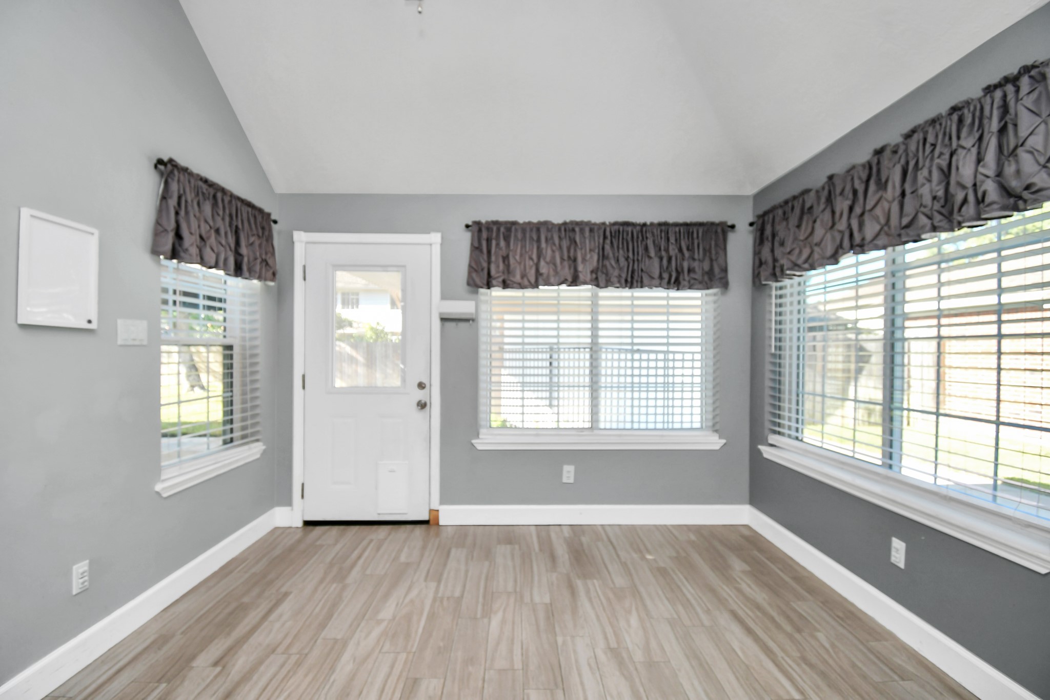 3642 Postwood Drive Spring, TX 77388 - Photo 24 of 43 a view of an empty room with wooden floor and a window
