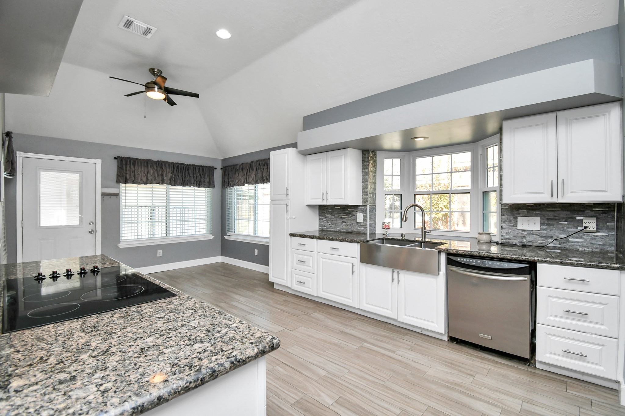 3642 Postwood Drive Spring, TX 77388 - Photo 30 of 43 a kitchen with a stove a sink a refrigerator and cabinets