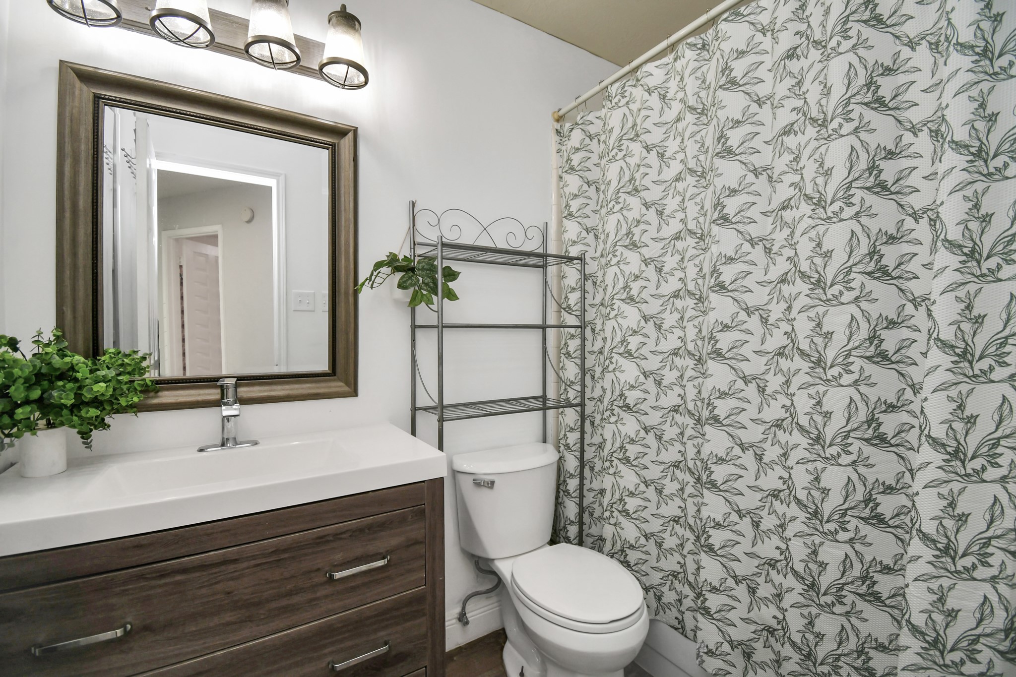 3642 Postwood Drive Spring, TX 77388 - Photo 32 of 43 a bathroom with a sink a toilet and mirror