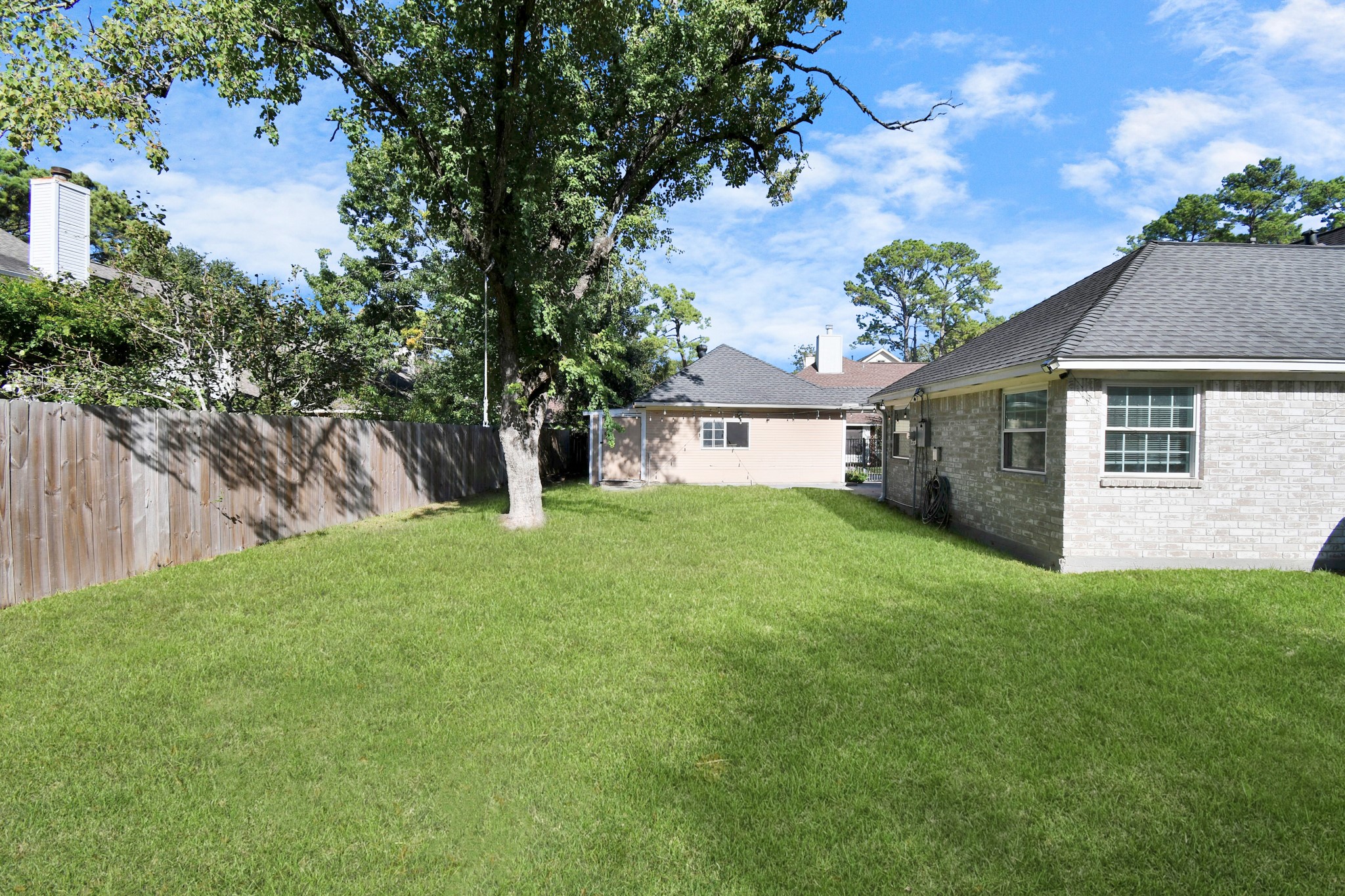 3642 Postwood Drive Spring, TX 77388 - Photo 39 of 43 a view of a yard in front of a house with large tree