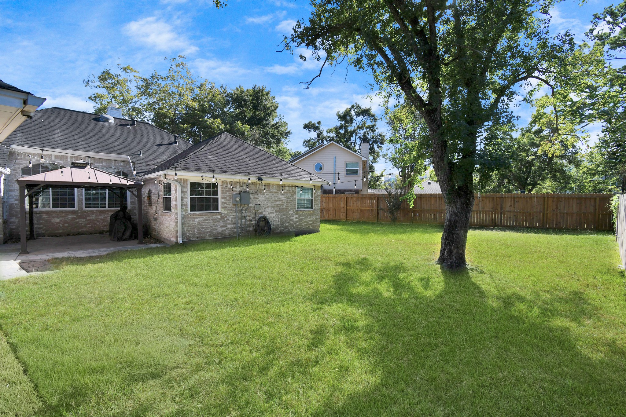 3642 Postwood Drive Spring, TX 77388 - Photo 40 of 43 a view of a house with backyard and a tree