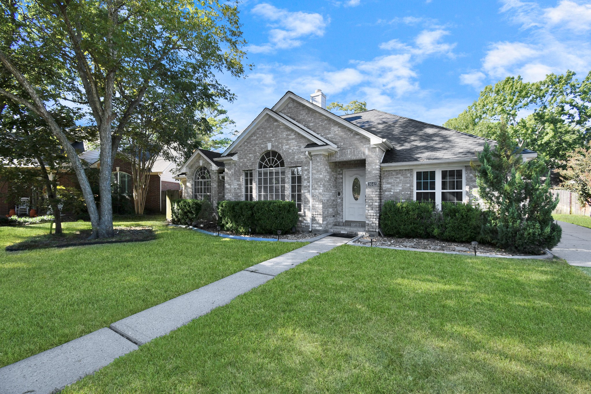 3642 Postwood Drive Spring, TX 77388 - Photo 4 of 43 a front view of a house with yard and green space