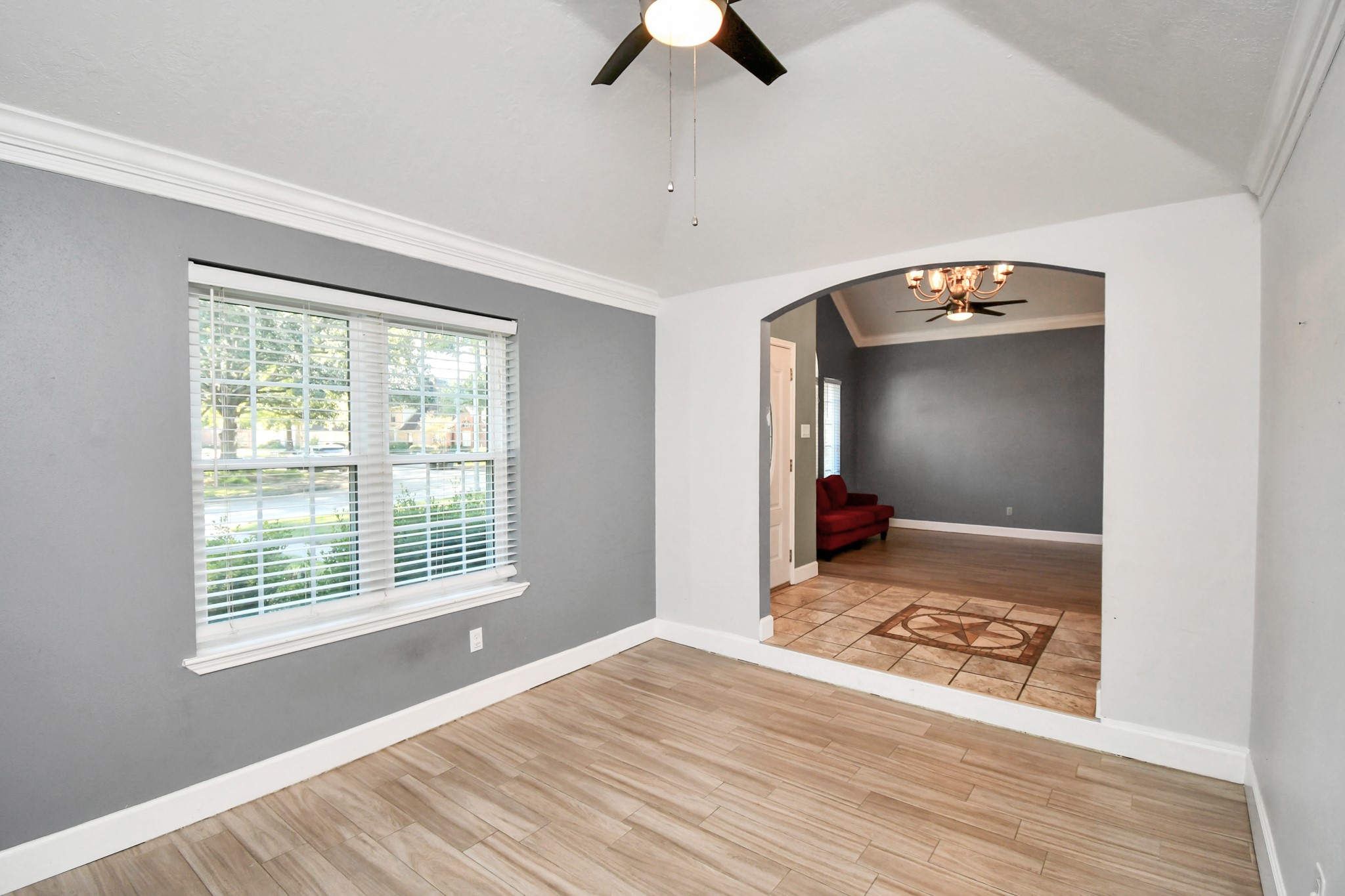 3642 Postwood Drive Spring, TX 77388 - Photo 8 of 43 a view of an empty room with window and wooden floor