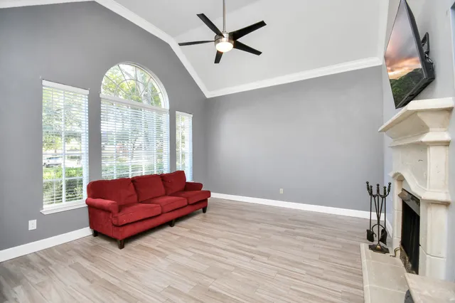 a living room with couch and a large window