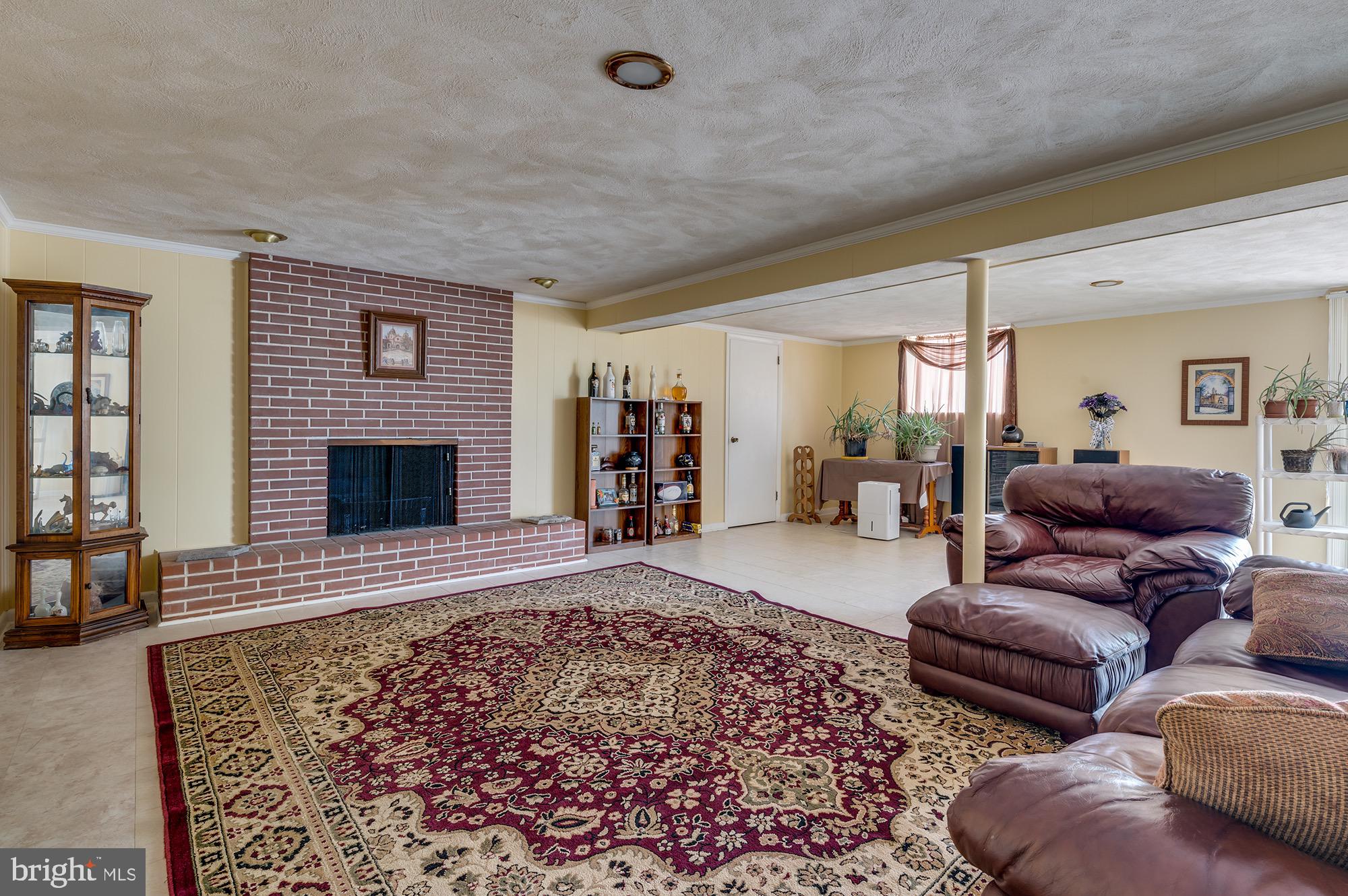 4505 Ridge Road Baltimore, MD 21236 - Photo 21 of 38 Lower level rec room w/fireplace