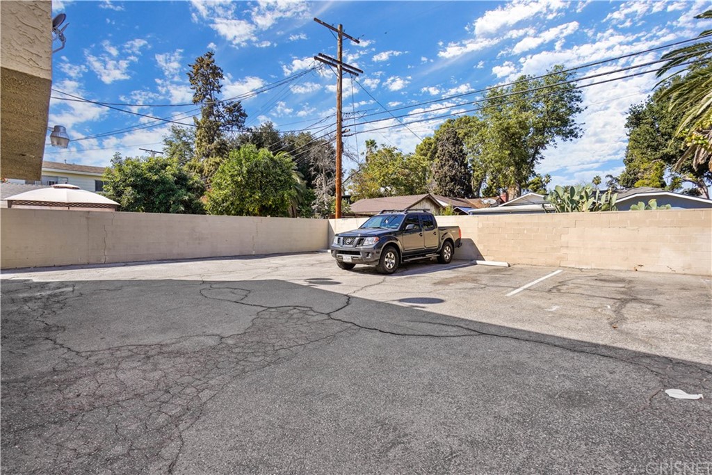 14607 Gilmore Street Van Nuys, CA 91411 - Photo 3 of 9 a car parked on the side of the road