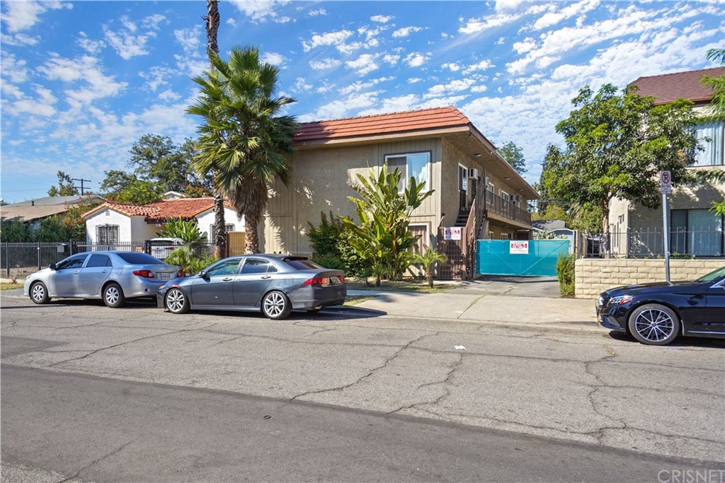 14607 Gilmore Street Van Nuys, CA 91411 - Photo 5 of 9 a car parked in front of a house