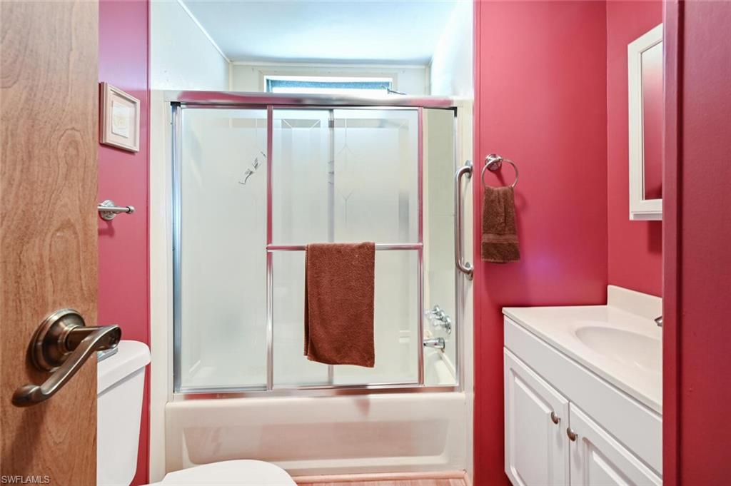 192 Oceans Boulevard, Unit 192 Naples, FL 34104 - Photo 14 of 26 a bathroom with a bathtub and shower
