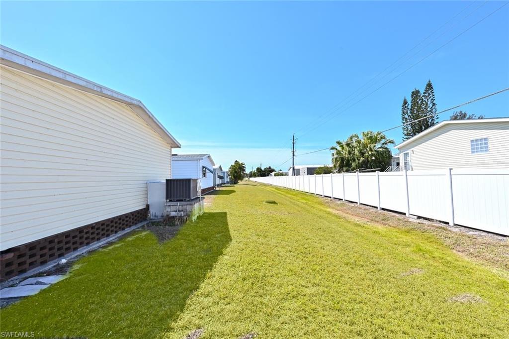 192 Oceans Boulevard, Unit 192 Naples, FL 34104 - Photo 18 of 26 a swimming pool with yard and outdoor seating
