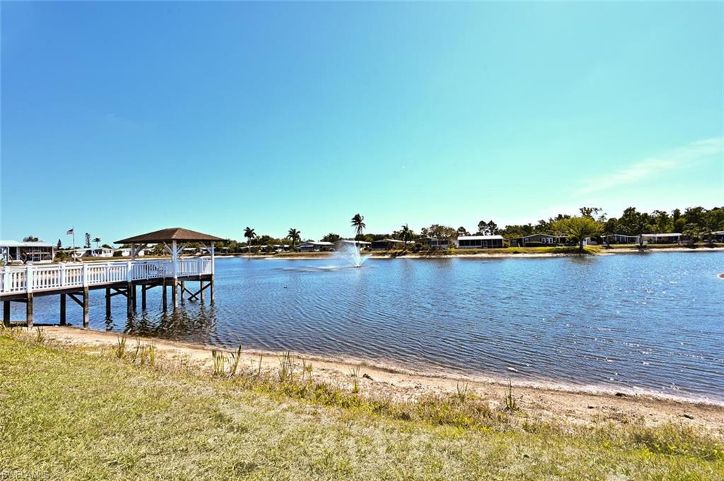 192 Oceans Boulevard, Unit 192 Naples, FL 34104 - Photo 19 of 26 a view of a lake with a house