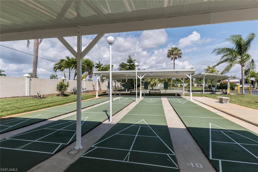 192 Oceans Boulevard, Unit 192 Naples, FL 34104 - Photo 22 of 26 a view of swimming pool with a yard