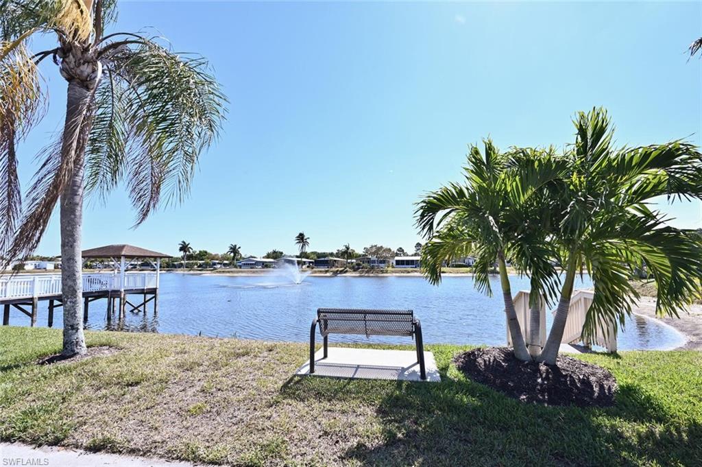 192 Oceans Boulevard, Unit 192 Naples, FL 34104 - Photo 3 of 26 a view of a backyard with plants and palm tree
