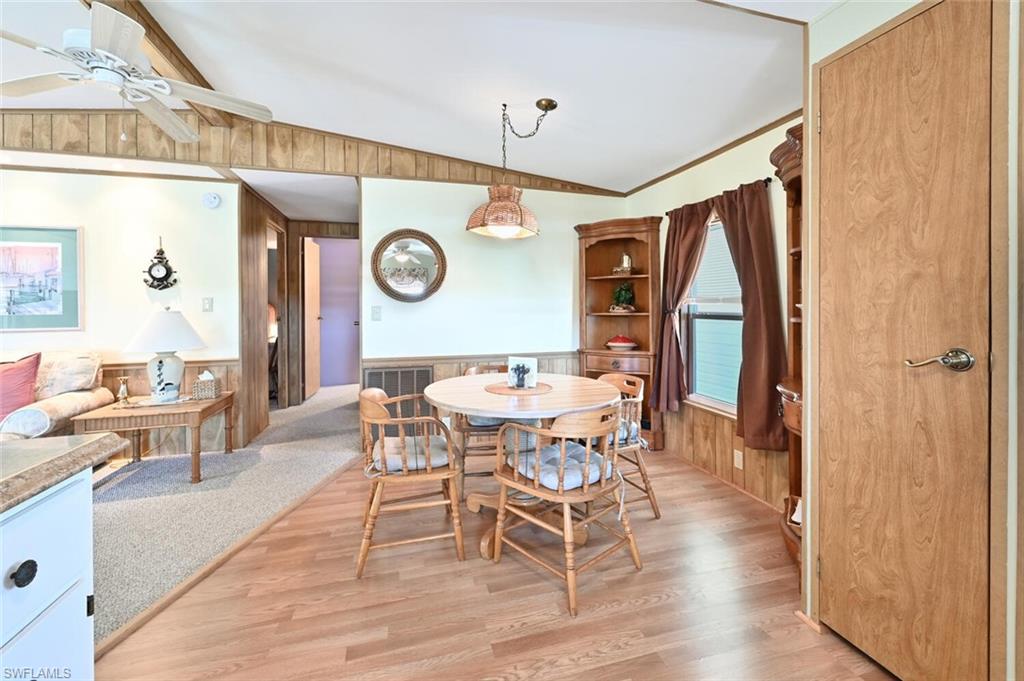 192 Oceans Boulevard, Unit 192 Naples, FL 34104 - Photo 9 of 26 a view of a dining room with furniture and a large window
