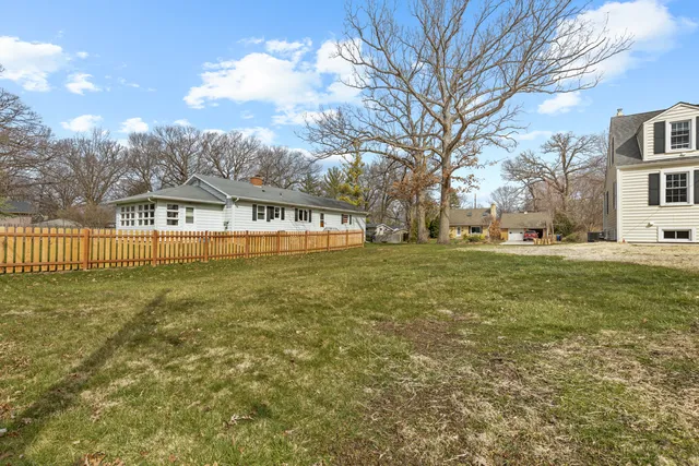 a view of a house with a big yard