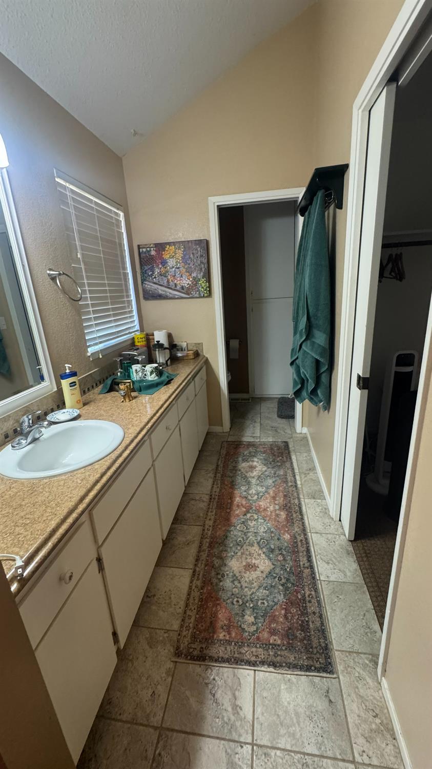 31160 Revis Road Coarsegold, CA 93614 - Photo 13 of 15 a bathroom with a sink toilet and shower