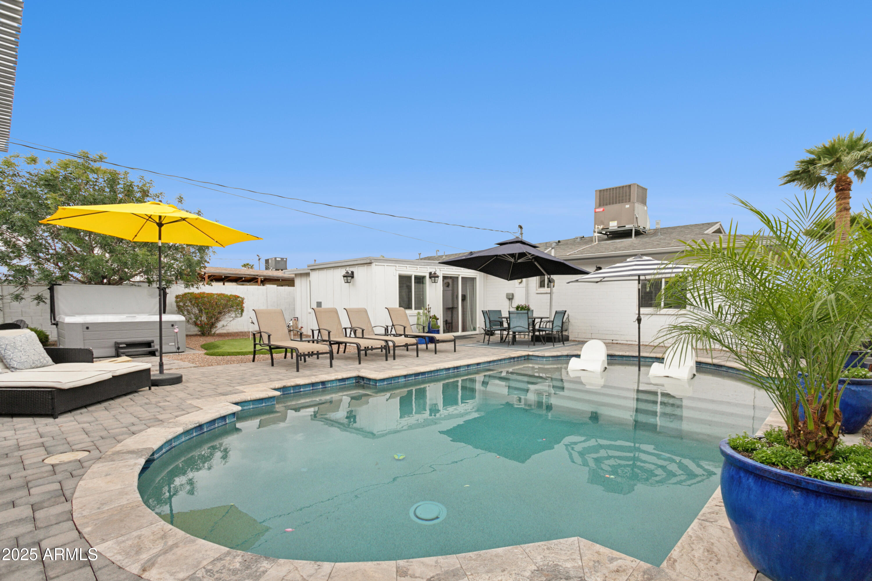 a view of a swimming pool with a patio