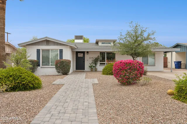 a front view of a house with an outdoor space