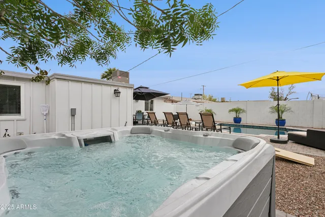 swimming pool view with a outdoor seating