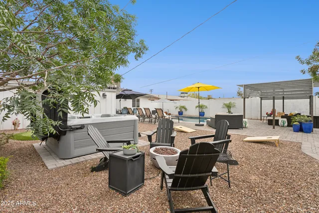 a view of a dinning table and chairs in the patio