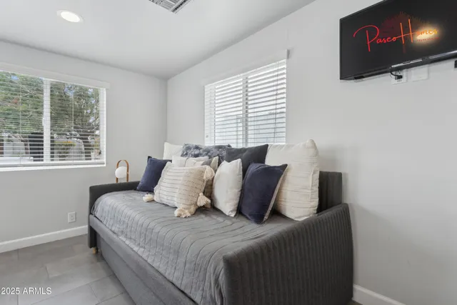 a bedroom with bed and window