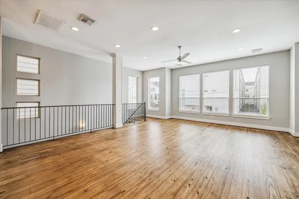 a kitchen with stainless steel appliances granite countertop a refrigerator a sink and a stove
