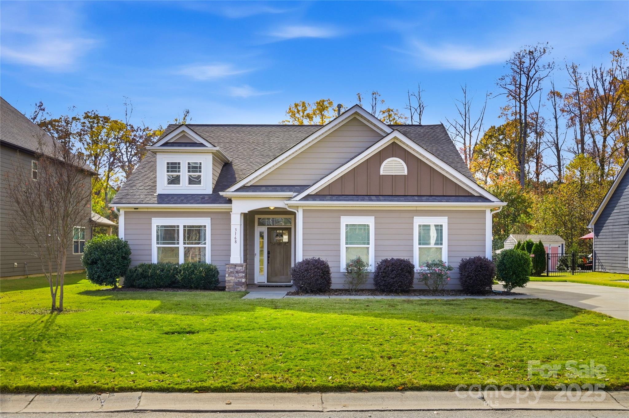 a front view of a house with garden