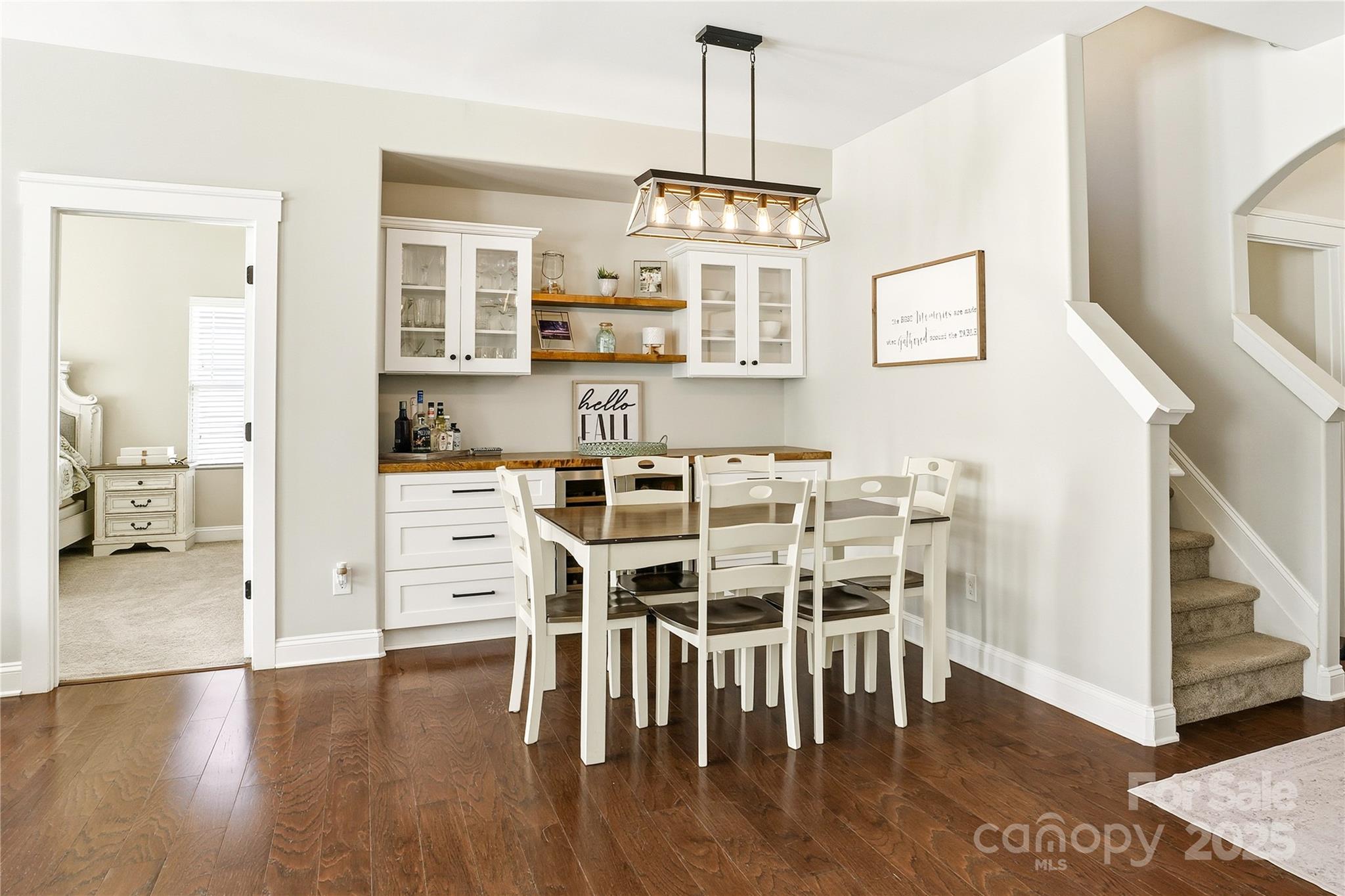 3168 Delaware Drive Denver, NC 28037 - Photo 15 of 47 a view of a dining room with furniture and wooden floor