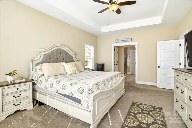 a bathroom with a shower sink and mirror
