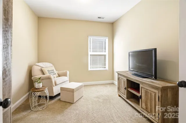 a bedroom with a bed and a dresser in it