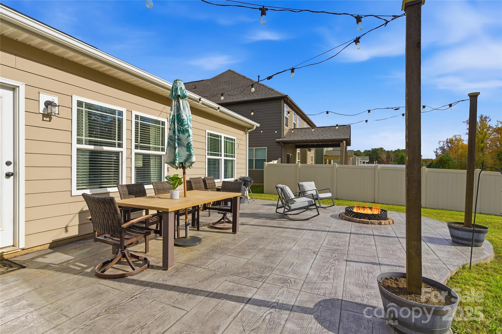 3168 Delaware Drive Denver, NC 28037 - Photo 36 of 47 a backyard view of a house with outdoor seating
