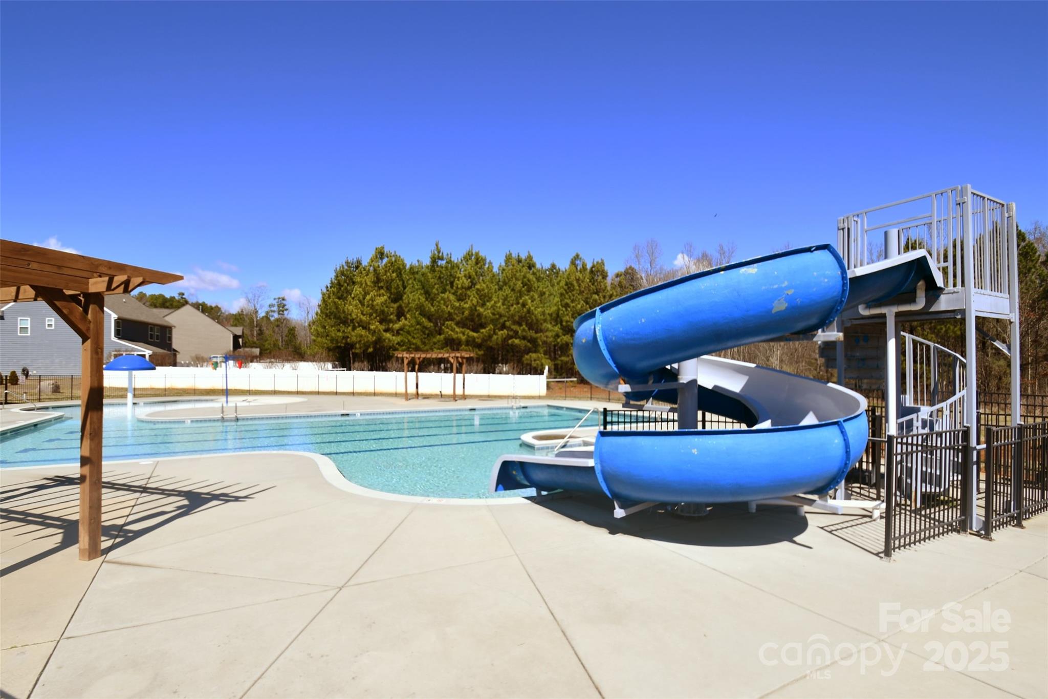 3168 Delaware Drive Denver, NC 28037 - Photo 46 of 47 a swimming pool with an outdoor seating and a terrace view