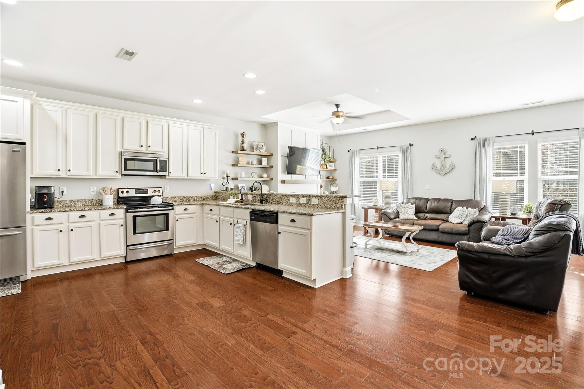 3168 Delaware Drive Denver, NC 28037 - Photo 10 of 47 a kitchen with a white cabinets and white appliances