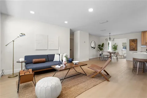 a living room with furniture and gym equipment