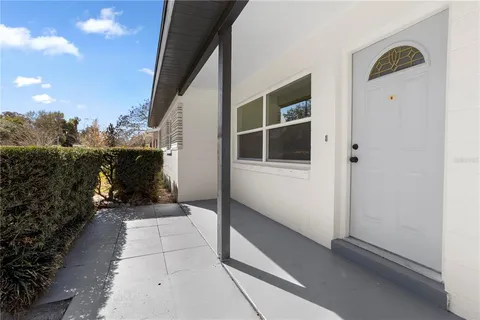 a view of a door and chair in the balcony