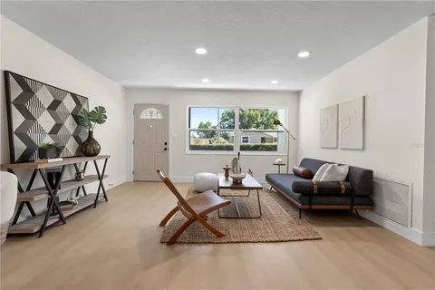 a living room with furniture and a large window
