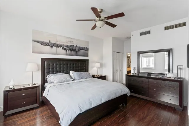 a bedroom with a bed and a dresser