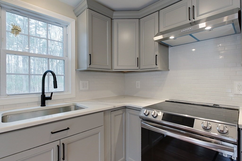 31 Turner Road Townsend, MA 01469 - Photo 3 of 38 a view of a kitchen with a sink and cabinets