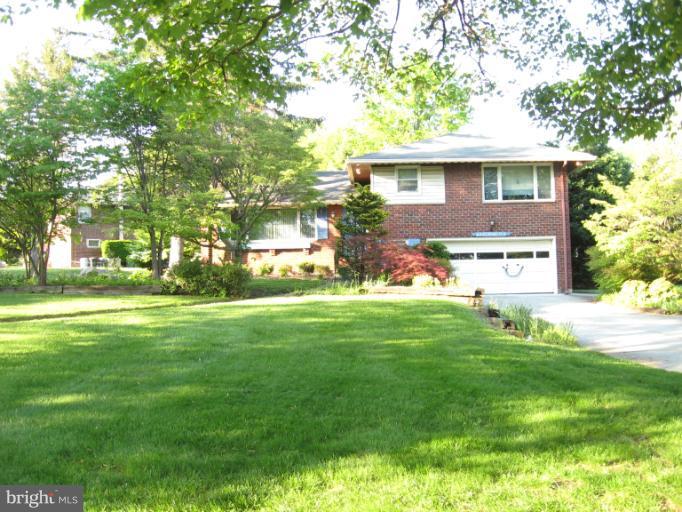 6601 Pimlico Road Baltimore, MD 21209 - Photo 3 of 12 a front view of house with yard and green space