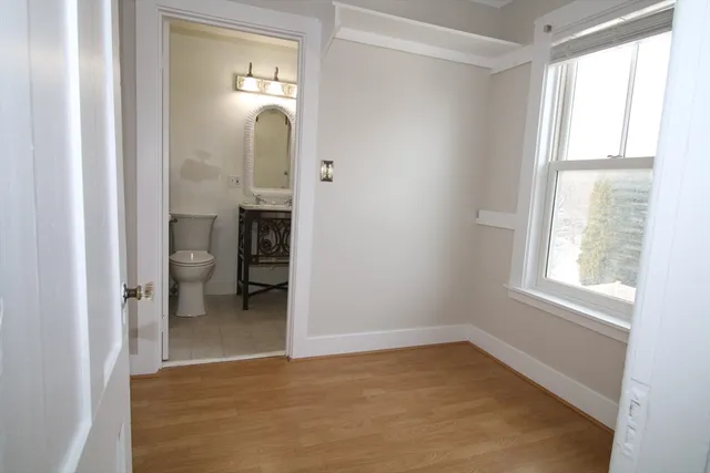 a view of a room with window and bathroom